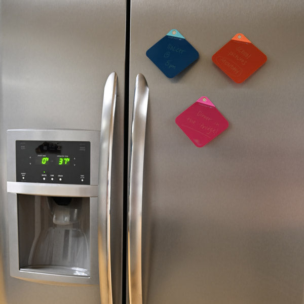 3 VersaNotes on a refrigerator