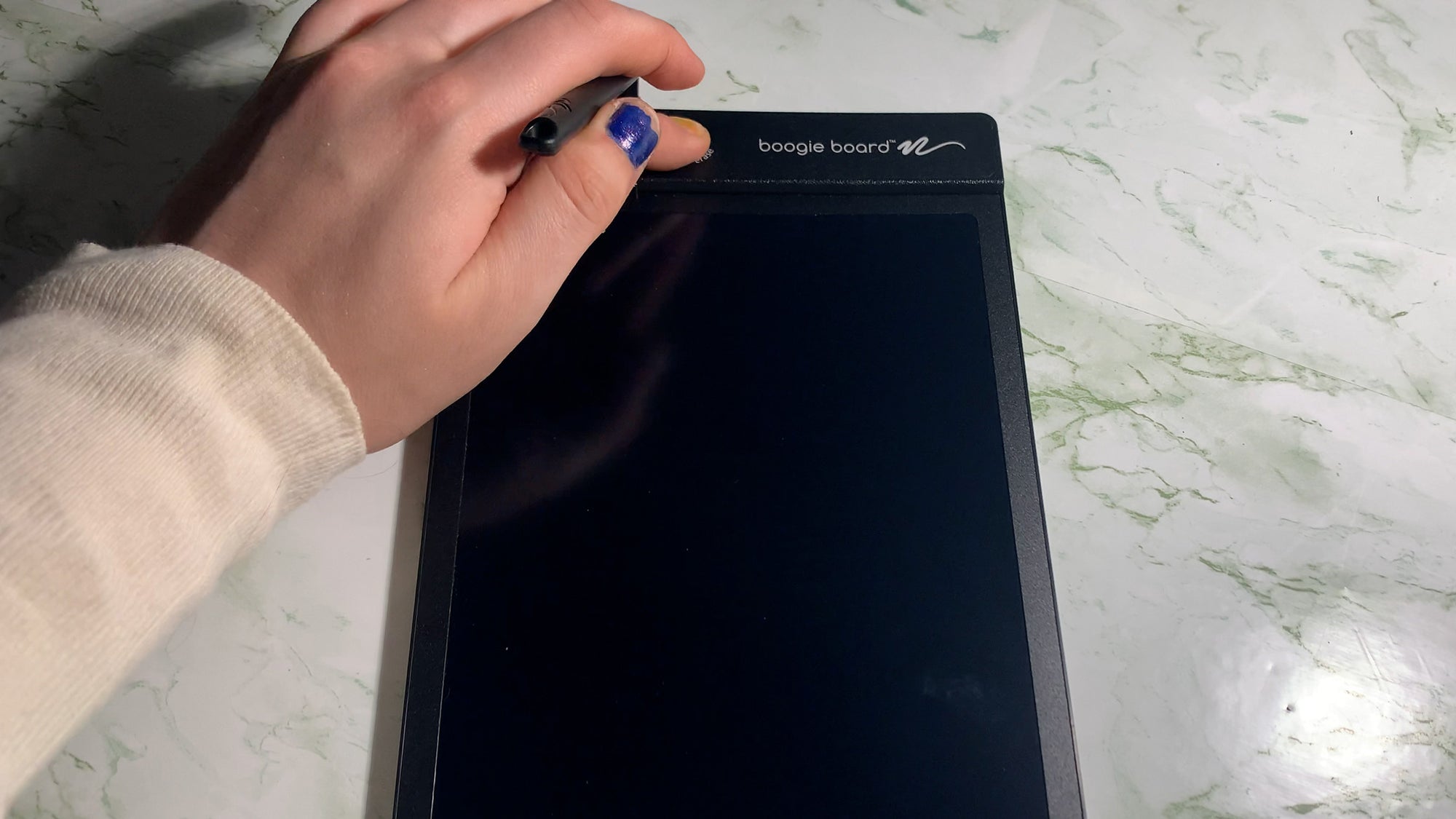Young girl pushing button to erase Basics