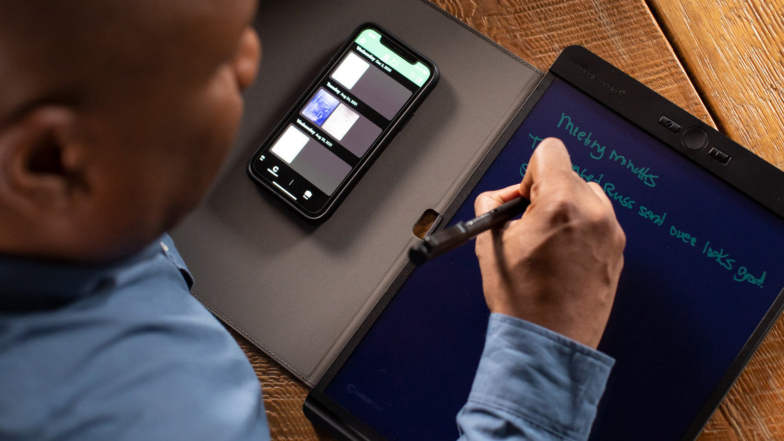 Overhead view of writing on tablet with Smart Pen while viewing app