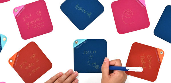 Overhead view of many VersaNotes on a white table