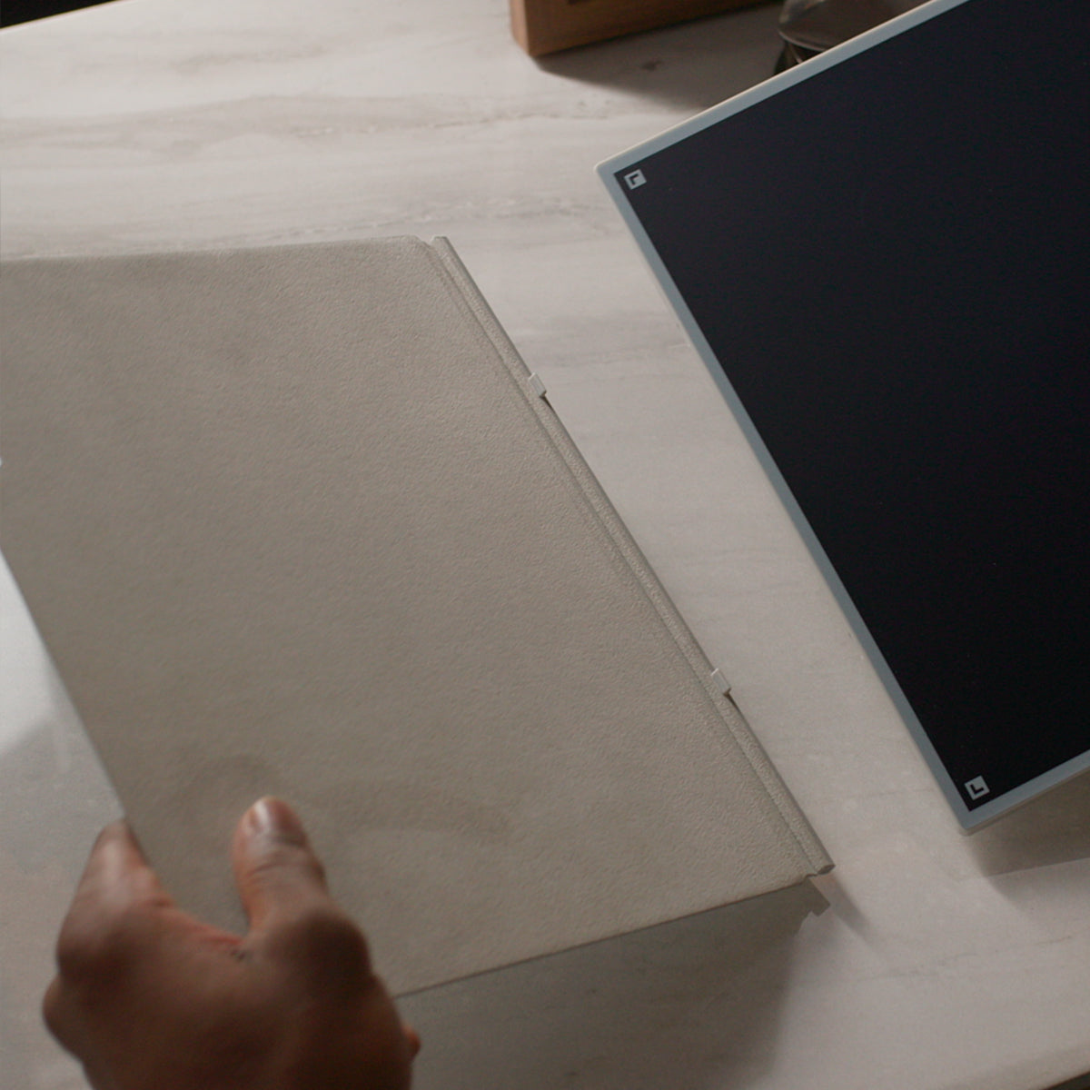 Image of someone attaching the magnetic folio cover to the Blackboard 2.0 board