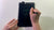 Overhead view of someone writing on a Boogie Board Basics