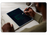 Over the shoulder view of a man using Blackboard Smart Pen to write on a Blackboard 2.0